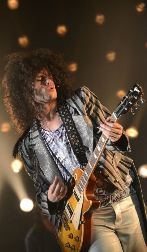 Warren Sollars in classic Marc Bolan pose with Gibson Les Paul